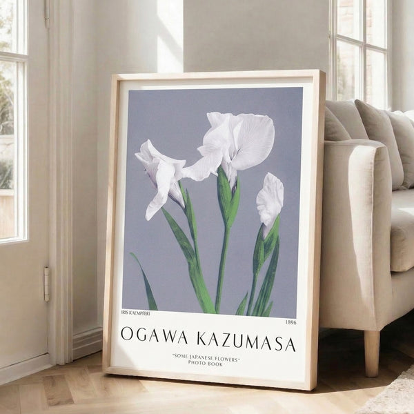 Framed botanical print of iris flower in restrained lavender, green, and cream tones, capturing quiet elegance of Japanese floral art tradition.