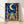 Serene art nouveau mosque illustration with crescent moon and stars in deep navy, gold, and turquoise, framed poster on wall with ornamental arabesques and botanical elements.