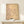 Japandi wall art featuring a crane rendered in traditional woodblock line drawing style with brown ink on cream-colored aged paper.