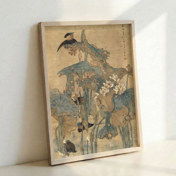 Japanese art print on wall showing ducks nestled among lotus blooms and water plants rendered in calm, naturalistic sage and cream hues.