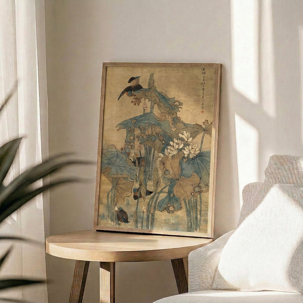 Framed botanical art print depicting birds among floating lotus leaves and plants in serene cream, sage, and soft blue Japanese aesthetic.