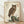 Framed Japanese woodblock print featuring a detailed owl perched on a rock among tall grasses and reeds, rendered in cream, black, brown, and olive tones with serene naturalistic style.