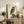 Serene Japanese woodblock-style wall art of an owl seated on stone surrounded by grasses, rendered in a restrained palette of cream, tan, olive, and charcoal.