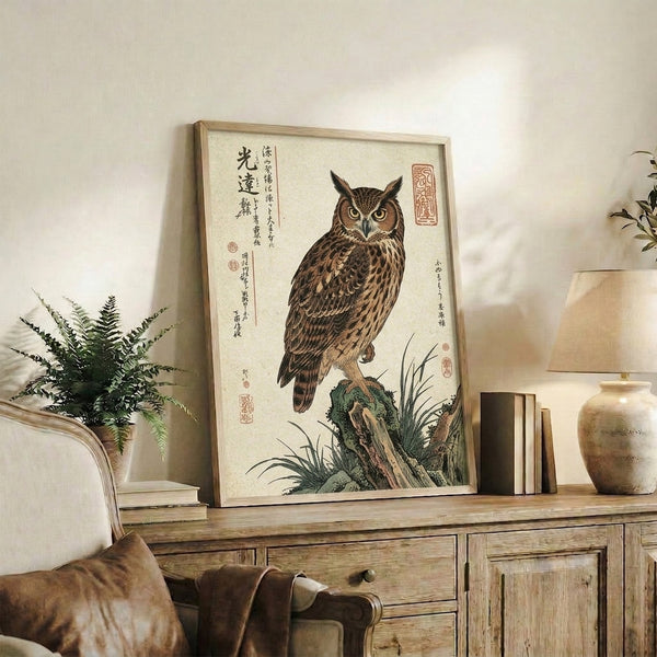 Serene Japanese woodblock-style wall art of an owl seated on stone surrounded by grasses, rendered in a restrained palette of cream, tan, olive, and charcoal.