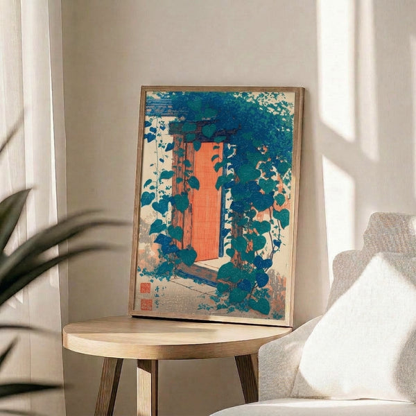 Framed woodblock-style poster depicting an intimate garden doorway draped in lush ivy vines, featuring tranquil zen aesthetics with a palette of teal, rust, and cream tones.