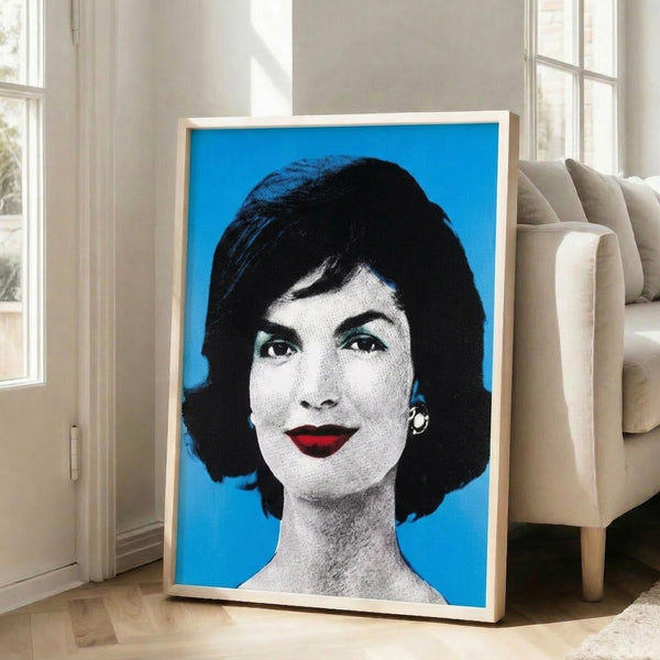 Modern pop art poster with stylized portrait rendered in saturated colors and stark contrast, displayed as a framed print.