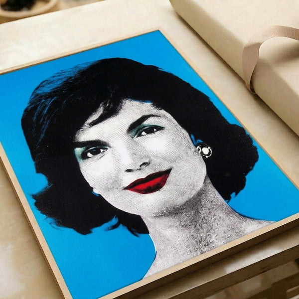 Iconic pop art style poster with a frontal portrait in vivid, clashing color schemes and clean graphic lines.
