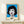 Modern wall art print displaying a monochromatic and silver-toned portrait of a woman rendered in flat graphic shapes and stark contrasts.