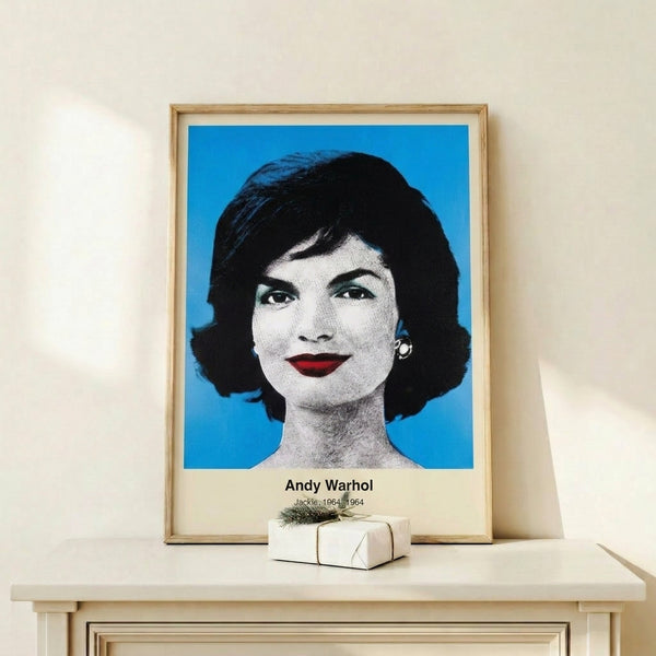 Modern wall art print displaying a monochromatic and silver-toned portrait of a woman rendered in flat graphic shapes and stark contrasts.