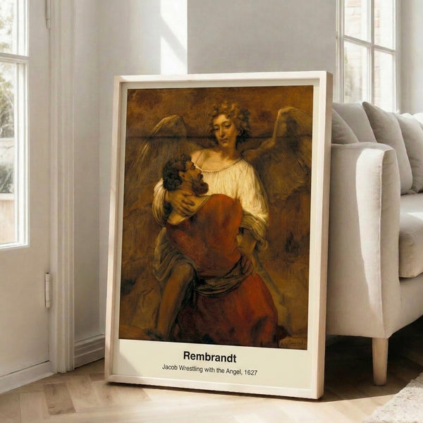 Framed reproduction of Rembrandt's masterpiece showing a muscular figure locked in intense struggle with an ethereal angel amid swirling shadows.