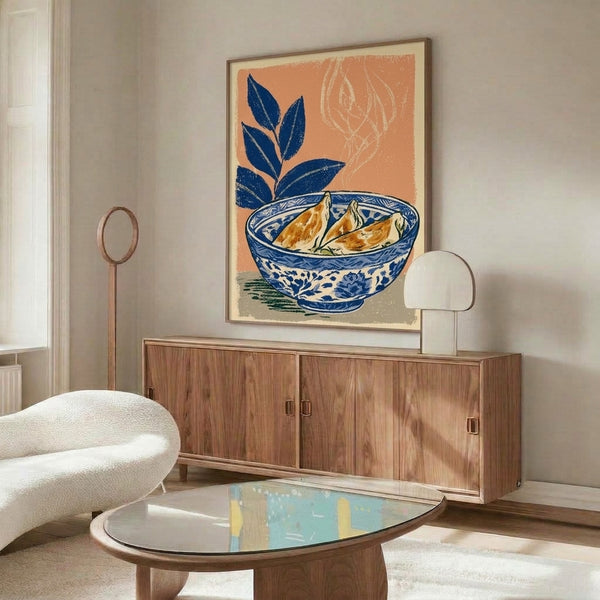Wall art print showing a tranquil composition of dumplings nestled in navy porcelain, accented with fresh ginger and sage foliage in minimalist Japanese woodblock technique.