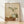 Minimalist watercolor poster featuring a sage green teapot with matching cup, dried branch, and ceramic vase arranged on a cream background in calm earth tones.