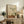 Japandi zen still life art print with soft watercolor teapot, cup, and botanical elements in sage, warm brown, and pale ochre creating a meditative home décor piece.
