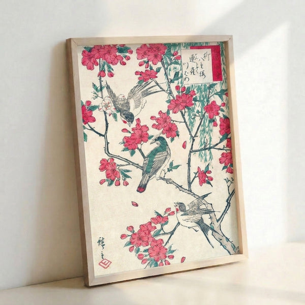 Traditional Japanese woodblock poster showing elegant birds among blooming cherry blossoms and hanging willow, composed in muted teal and rose hues with intricate black ink detailing.