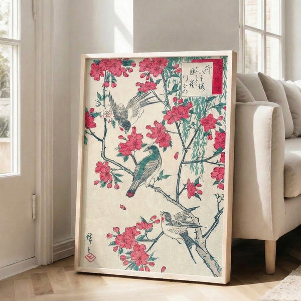 Framed woodblock print in ukiyo-e style portraying birds resting on flowering branches with drooping willow, executed in a refined palette of cream, rose pink, deep teal, and black.