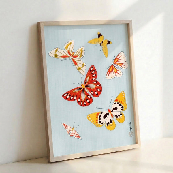 Serene butterfly composition with naturalistic rendering in red, gold, and black accents on a soft blue ground, presented as a framed art print.