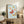 Framed wall art depicting gracefully rendered butterflies in warm and cool tones—red, gold, black lines, and cream-blue ground—in the style of classical Japanese woodblock art.