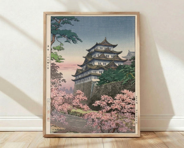 Serene Japanese woodblock-style poster of Nagoya Castle surrounded by pale pink cherry blossoms and forest green trees, rendered in soft cream and gold tones.