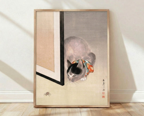Japanese woodblock style poster featuring a contemplative grey cat adorned with a flowing red-orange ribbon, rendered in cream, black, and turquoise tones with delicate, whimsical detail.