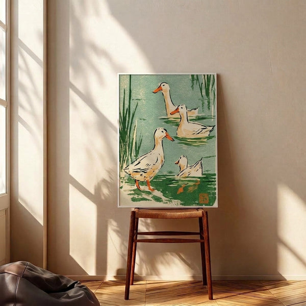 Vintage-inspired art print featuring waterfowl among pond reeds in the style of Japanese woodblock prints, with a naturalistic palette of sage and dark greens, cream, and warm orange hues.
