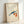 Zen wall art depicting a fish and fruit composition in muted cream, indigo, and coral hues with delicate plant elements, framed in serene Japanese style.