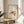 Framed minimalist fish and fruit wall art with indigo mackerel, coral-orange persimmons, and green plants on cream ground, evoking tranquil Japanese tradition.