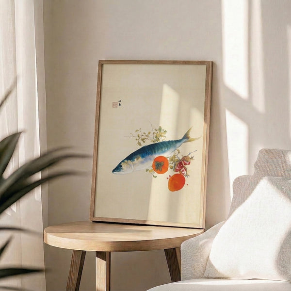 Framed minimalist fish and fruit wall art with indigo mackerel, coral-orange persimmons, and green plants on cream ground, evoking tranquil Japanese tradition.