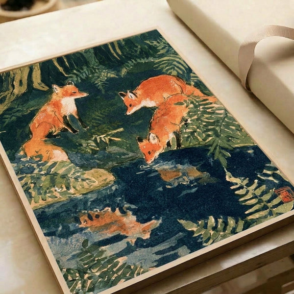 Framed wall art of foxes among ferns and trees beside flowing water, combining Japanese woodblock aesthetics with Japandi design sensibilities in earthy, serene color palette.