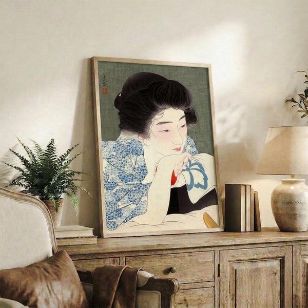 Showa-period inspired geisha figure as a framed wall print, executed in Japanese woodblock style with serene expression and refined use of black, cream, and blue-green hues.