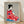 Elegant Showa-era woodblock print of a geisha in a vibrant red kimono holding a decorative fan, rendered in rich reds, blues, and blacks with cream accents.