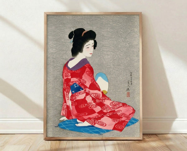 Elegant Showa-era woodblock print of a geisha in a vibrant red kimono holding a decorative fan, rendered in rich reds, blues, and blacks with cream accents.