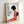 Minimalist Japanese poster showcasing a girl in red kimono among botanical elements, executed in a classic woodblock style with black, white, and soft pink accents conveying quiet contemplation.