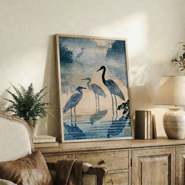 Contemplative Japandi art print depicting graceful herons among water and vegetation in soft teal and pale ochre hues, evoking timeless Zen tranquility.