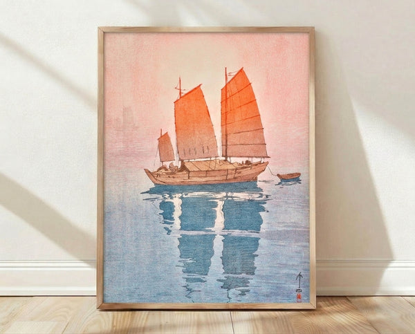 Japanese woodblock print of a traditional sailing junk on calm water with soft pink and deep blue tones, serene and contemplative vintage nautical art.