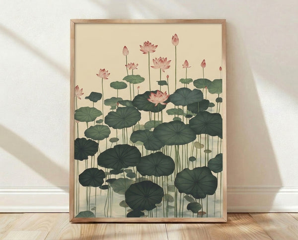 Serene framed poster of a lotus flower floating on water with lily pads, rendered in Japanese woodblock style with soft rose pink, sage green, and teal tones on a cream background.