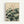 Japandi wall art featuring a peaceful lotus bloom and leaves in muted palette of pale green and dark teal, displayed as a framed print in contemplative Japanese aesthetic.