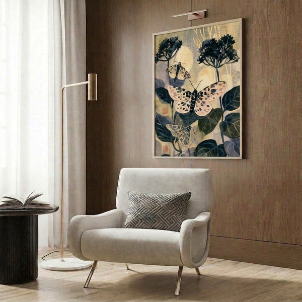 Calming nature-inspired wall art print portraying tiger moths and moonlit flowers in restrained palette of cream, black, and muted gold, executed in delicate Japanese botanical illustration style.