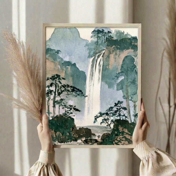 Framed watercolor print of a tranquil mountain waterfall nestled among dense forest trees, combining Japanese woodblock aesthetics with impressionist brushwork in calming sage and blue hues.