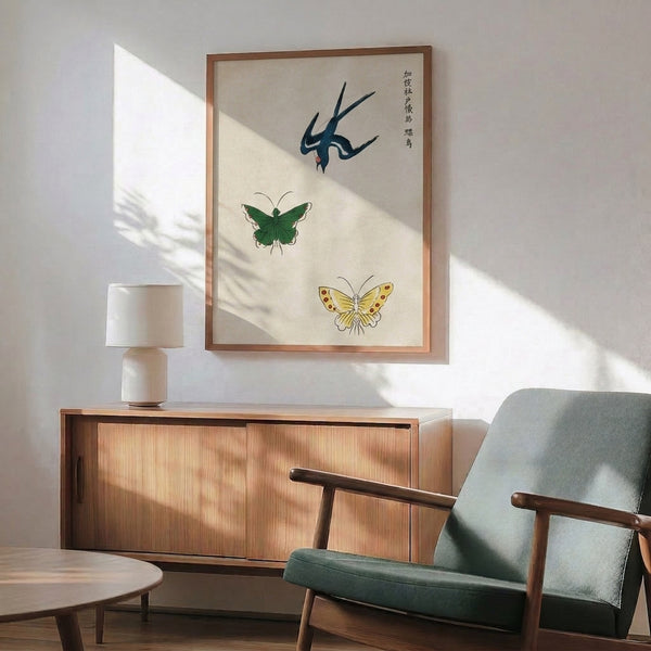 Framed Japanese art depicting a naturalistic bird with intricate butterfly and insect details in muted cream, pale yellow, and forest green palette.