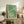Elegant Japanese-style framed poster with crane and enso circle in a refined color palette of moss green, cream, and soft ochre, evoking meditative calm.