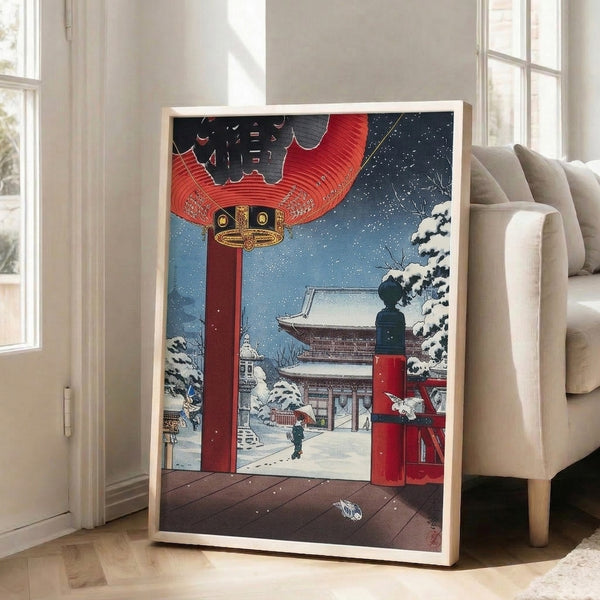 Wintry temple scene rendered in classic Japanese woodblock style with blue and white snow, red lantern glow, gold accents, and a solitary figure beneath frosted branches.