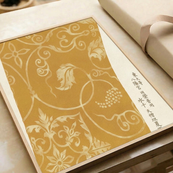 Ornamental Japanese botanical pattern in warm gold tones with graceful scrolling flourishes, combining woodblock and Art Nouveau influences in a framed art print.