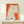 Framed wabi-sabi inspired print of a kimono garment rendered in Japanese woodblock style using earthy orange, cream, and black tones.