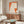 Traditional Japanese woodblock kimono print with refined minimalist composition in warm orange, cream, and neutral tones, celebrating textile artistry.