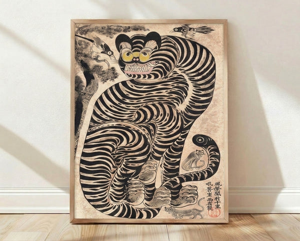 Japanese woodblock print featuring a striped tiger with playful whimsy, accompanied by a bird and monkey in folk art style, rendered in cream, black, and ochre tones.