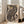 Framed art print in traditional Japanese aesthetic featuring a decorative striped tiger amid folk creatures in warm cream, black, and tan hues.