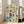 Nostalgic Japanese Showa era poster grid with four scenic panels featuring serene natural landscapes, cultural landmarks, and figures rendered in soft cream, cobalt blue, and rust orange hues.