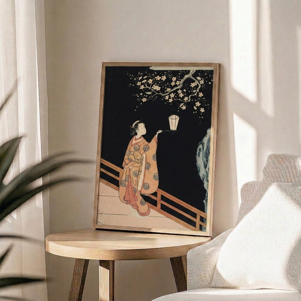 Japandi-style print depicting serene woman with glowing lantern under cherry blossoms, rendered in traditional woodblock aesthetic with cream, coral, black, and blue accents.
