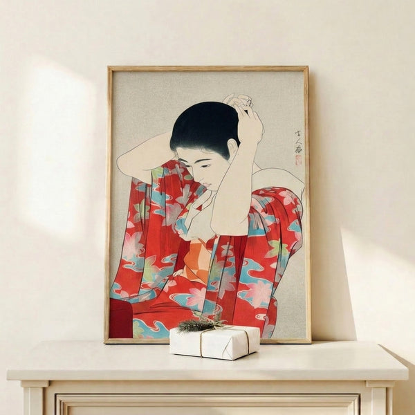 Framed woodblock-style portrait of a contemplative geisha adorned in patterned kimono with rich red and cream tones.