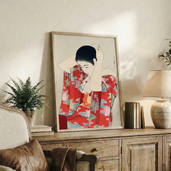 Introspective geisha portrait in woodblock style, wearing traditional kimono with red, cream, and turquoise hues, displayed as framed wall art.